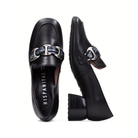 A pair of black leather loafers with a silver-tone horsebit hardware strap featuring a blue patterned center, shown from both top and side angles on a white background. The brand name 'HISPANITAS' is printed on the insole.